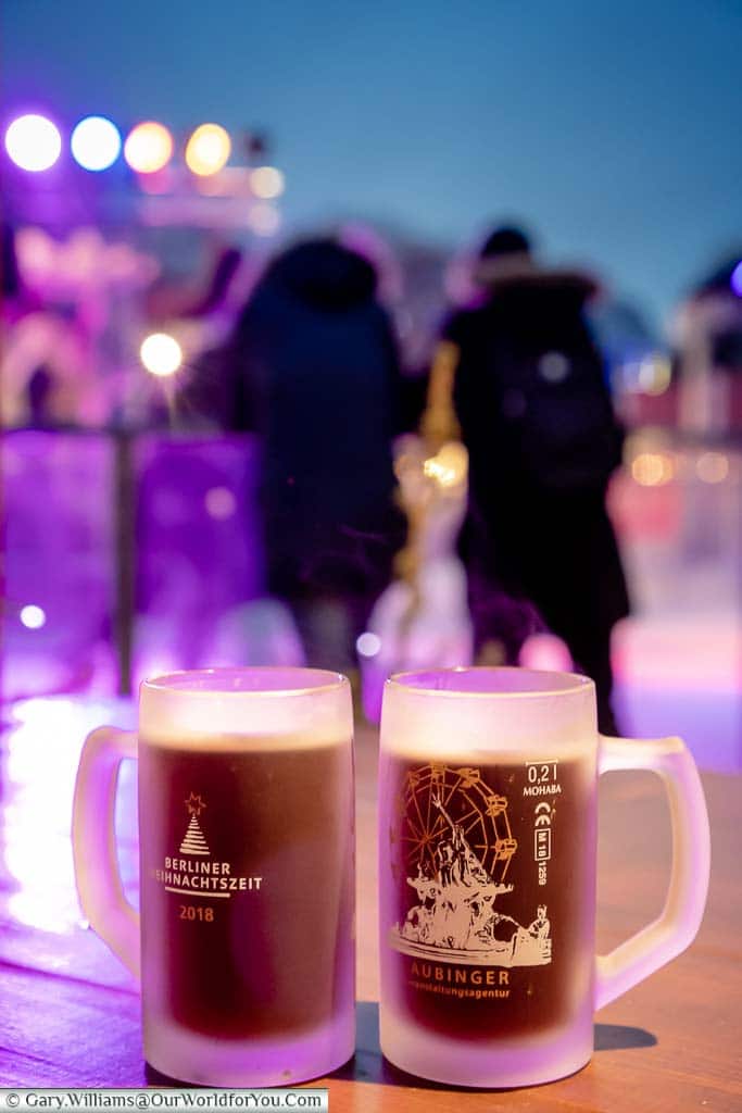Two steaming red glühweins in frosted translucent glasses at the Berliner Weihnachtszeit Christmas Market.