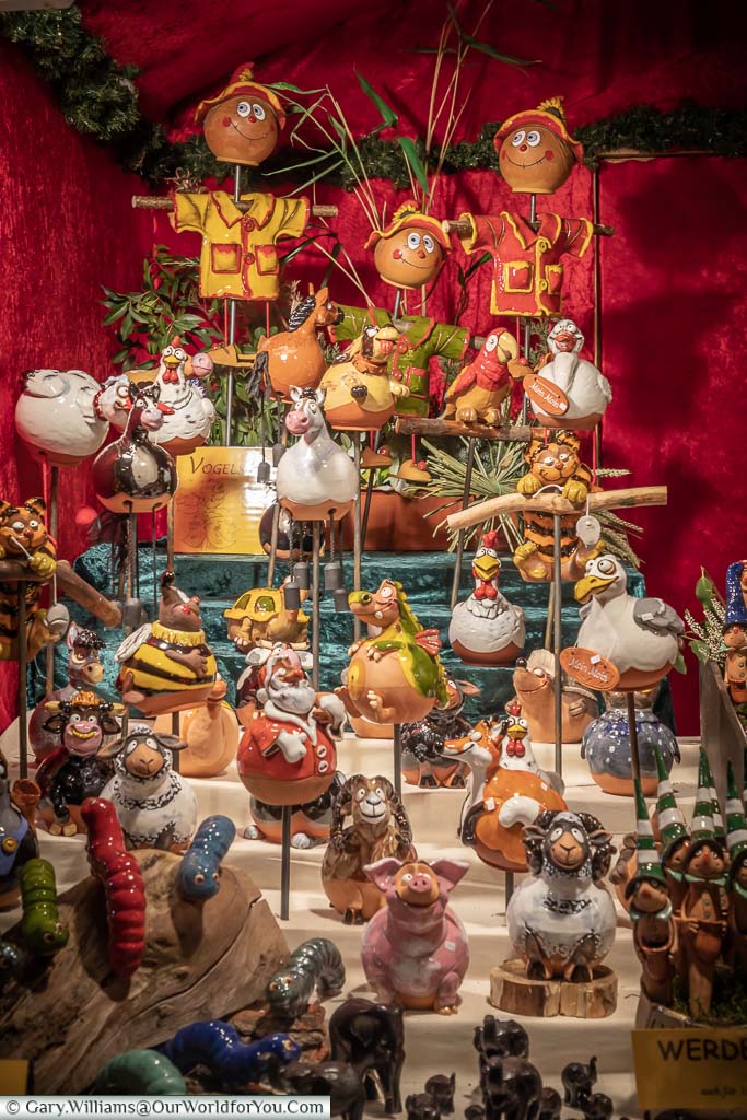 A collection of unique and somewhat quirky china ornaments on a craft stall in the Christmas markets of Bremen, Germany