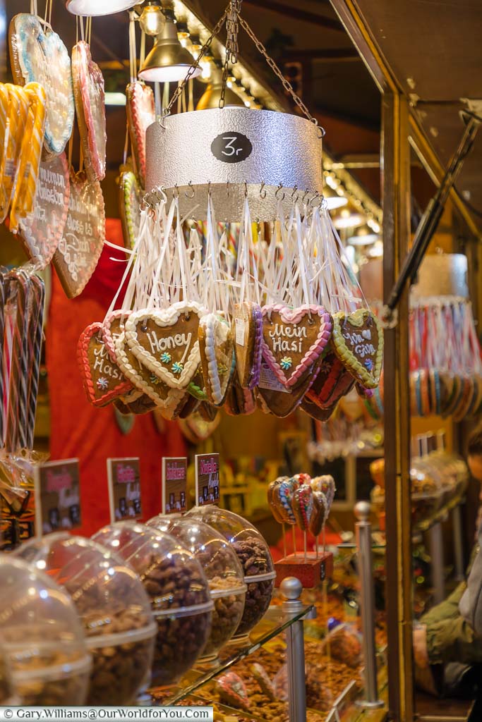 A close-up of gingerbread cookies hanging from a stall in Hamburg's Winterwald Christmas Market