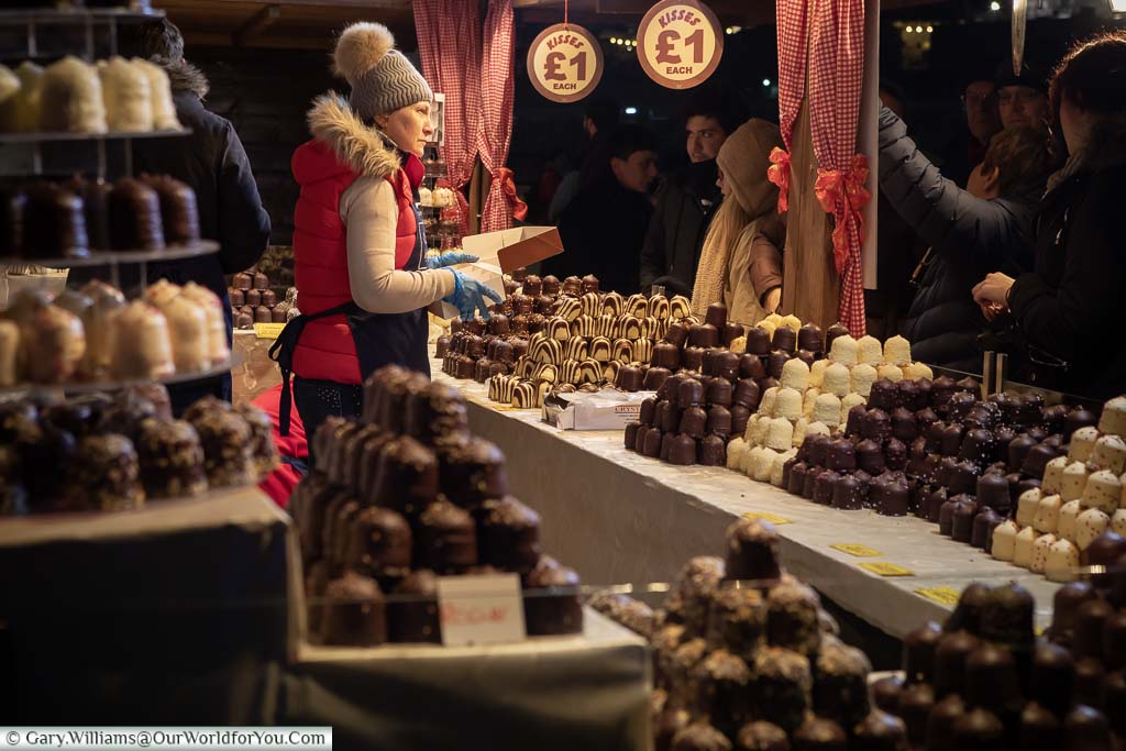 A Christmas Market stall set out in front of London's City Hall selling Chocolate kisses cakes, just like the German Christmas Markets.