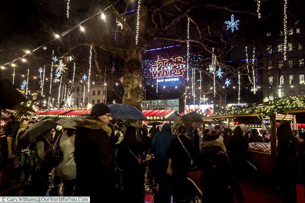 Crowds in the Leicester Square Christmas Market in Central London