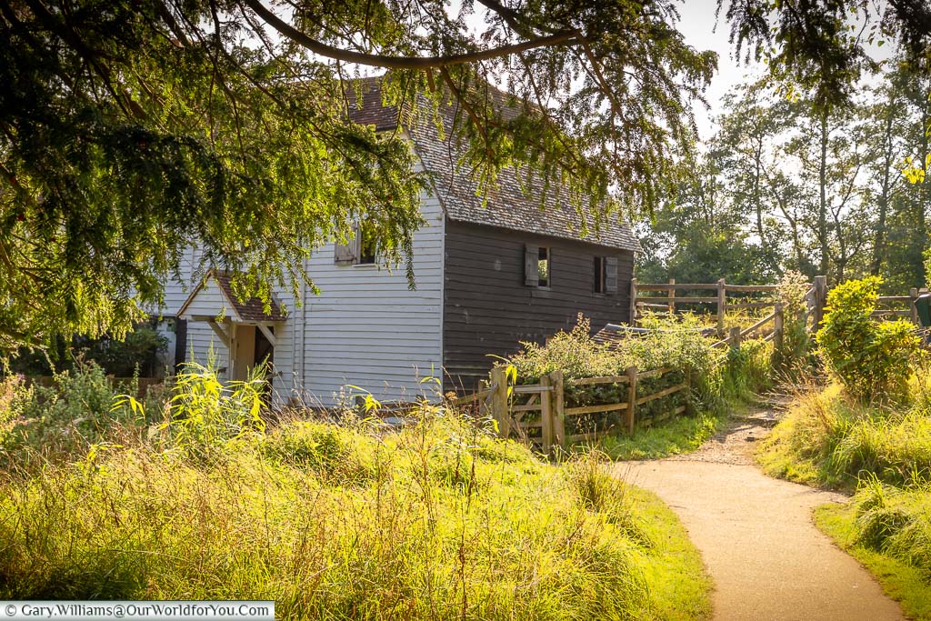 The path leading to the white weatherboarded Park Mill at Bateman's in East Sussex