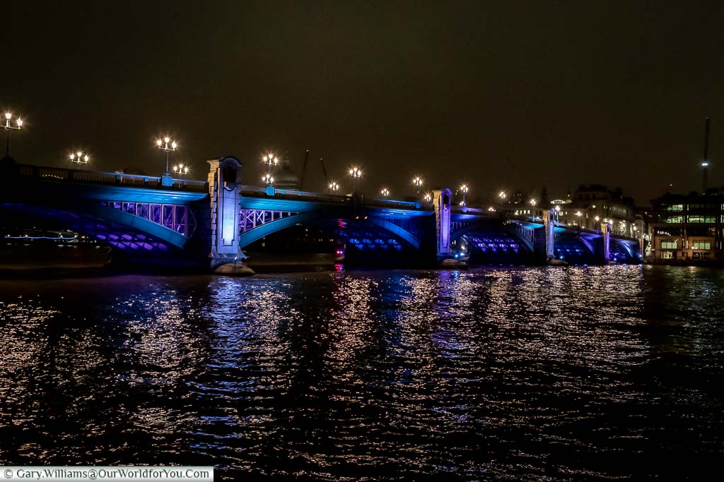 Southwark Bridge, across the River Thames, lit at night for Christmas