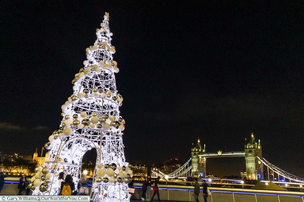 London’s City Hall Christmas Tree in front of Tower Bridge in the background.