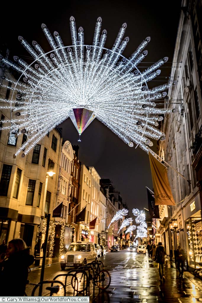 An illuminated star hanging above New Bond Street as part of London at Christmas