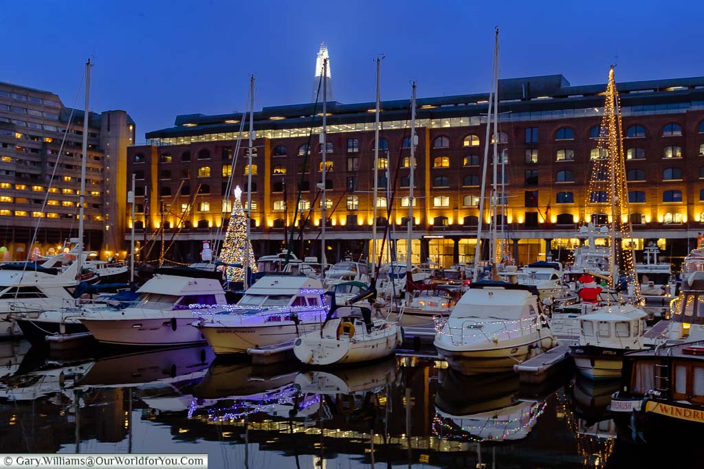 Boats in St Katharine Docks in London decorated for Christmas.