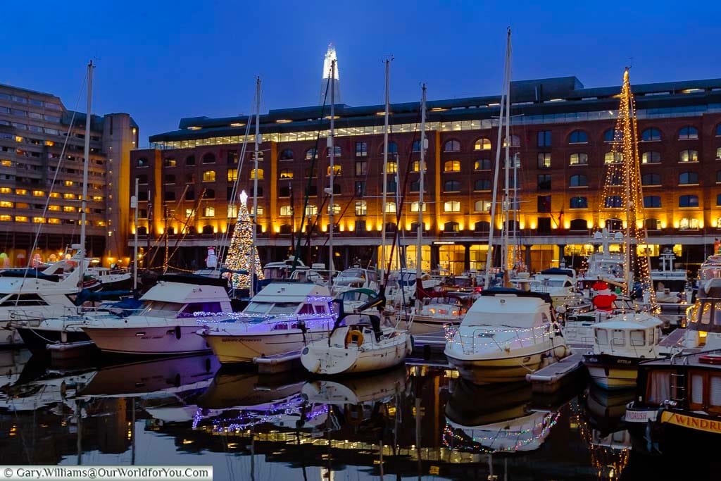 Boats in St Katharine Docks in London decorated for Christmas.