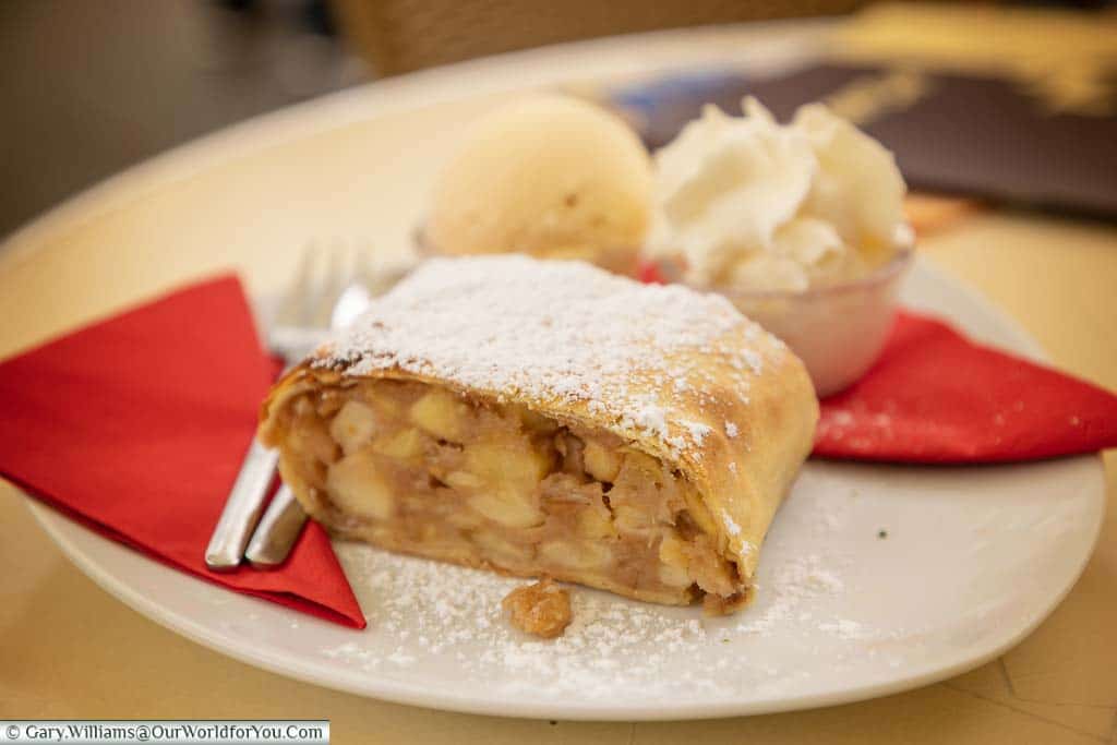A plate of apple strudel served with cream & ice cream from a cafe in Münster, Germany