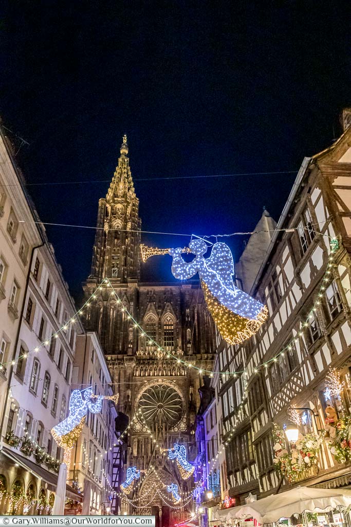 Angels with trumpets illuminate the way along Rue Mercière to Strasbourg's cathedral.