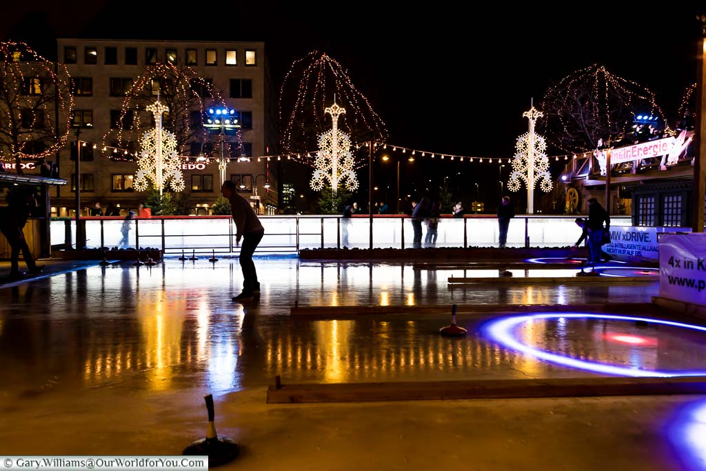 A view of ice stock curling lanes, after dusk, as part of Cologne's Christmas Markets