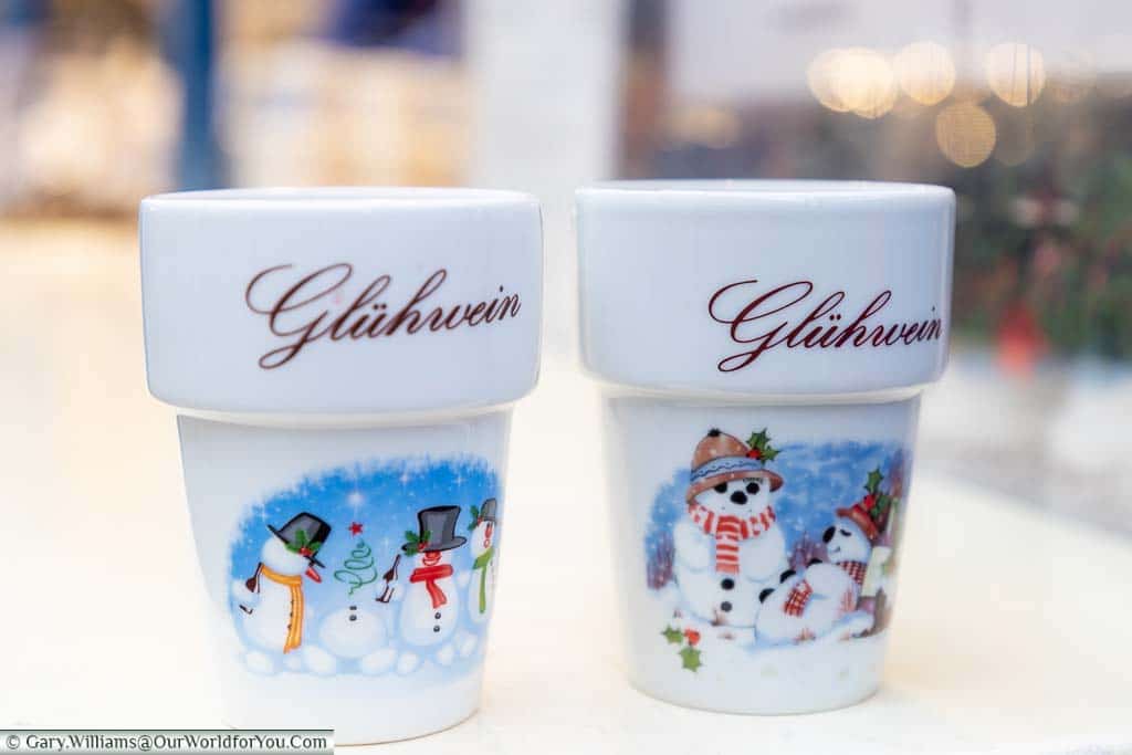 Two glühweins in white ceramic flower pot mugs at the St. Lamberti Christmas Markets in Münster