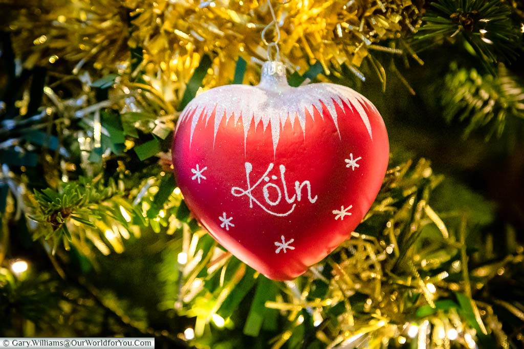Our Cologne Christmas bauble; bright red with a glitter iced topping.  Koln is written the traditional German way.