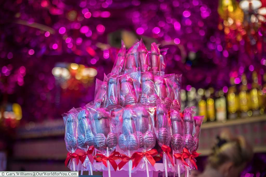 A display of pink lit, wrapped, chocolate phalluses on a stall in Cologne's Heavenue Christmas Market