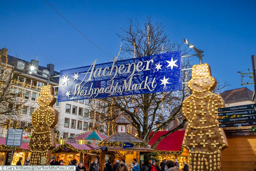 Two giant gingerbread men flank the entrance to the Aachener WeihnachtsMarkt German Christmas Market
