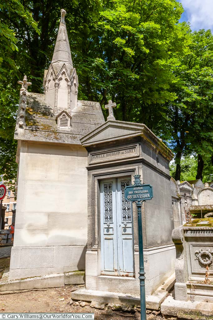 A pair of tombs on the Avenue Des Peupliers within the Père Lachaise Cemetery in Paris, France