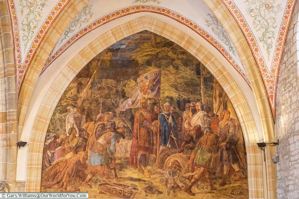A fresco in Aachen's Coronation Hall painted in the vaulted ceiling's archway