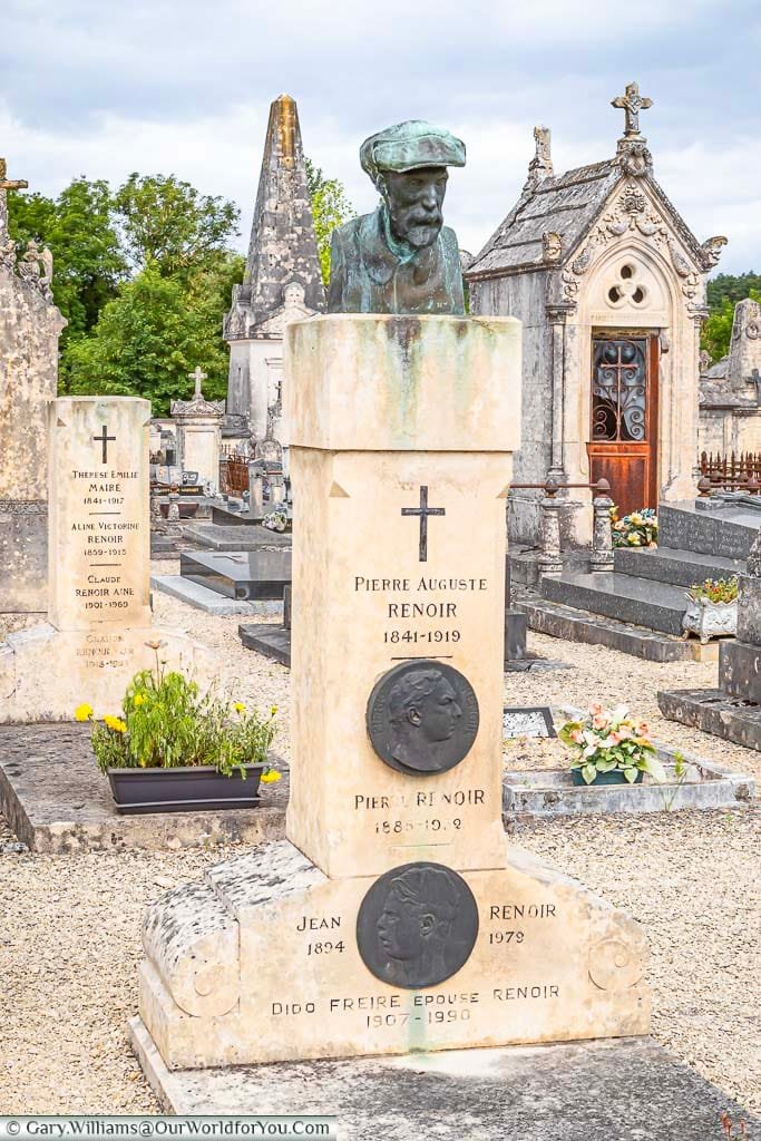 A bust on top of a pillar of the grave of Pierre Auguste Renoir in a cemetery in Essoyes, France