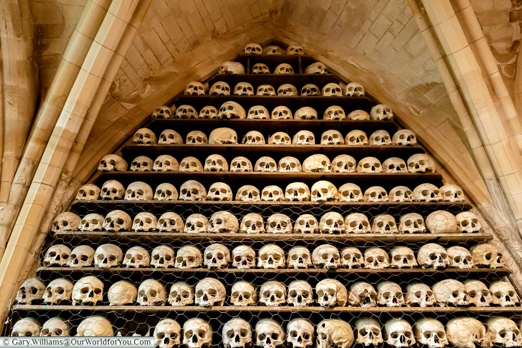 Skulls stacked on shelves at the ossuary at St. Leonard’s Church and Crypt in Hythe