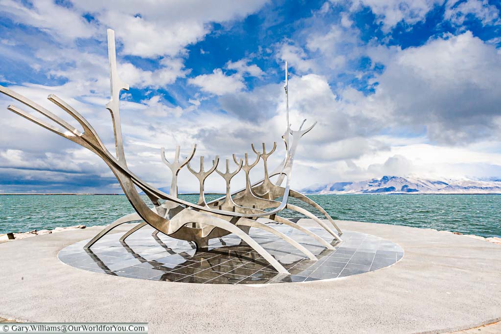 The stainless steel art installation call the Sun Voyager representing the skeleton of a Viking longship on the edge of the harbour in Reykjavik, Iceland