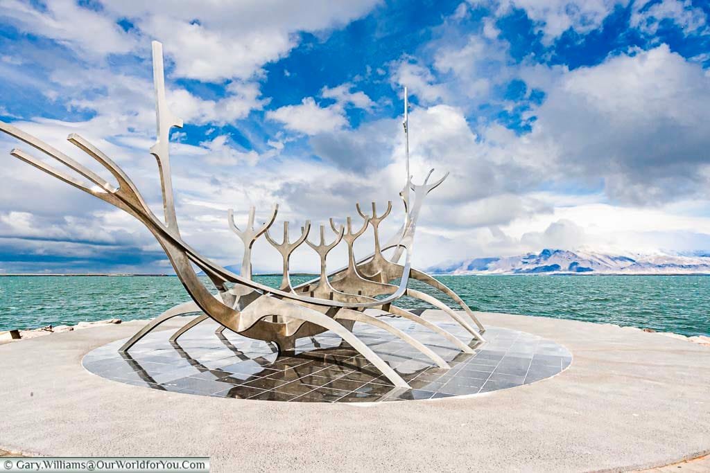 The stainless steel art installation call the Sun Voyager representing the skeleton of a Viking longship on the edge of the harbour in Reykjavik, Iceland