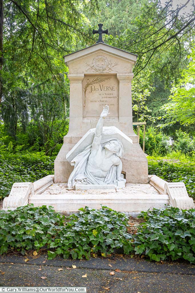 A marble figure breaking free from the grave of Jules Verne in Amiens cemetery, France