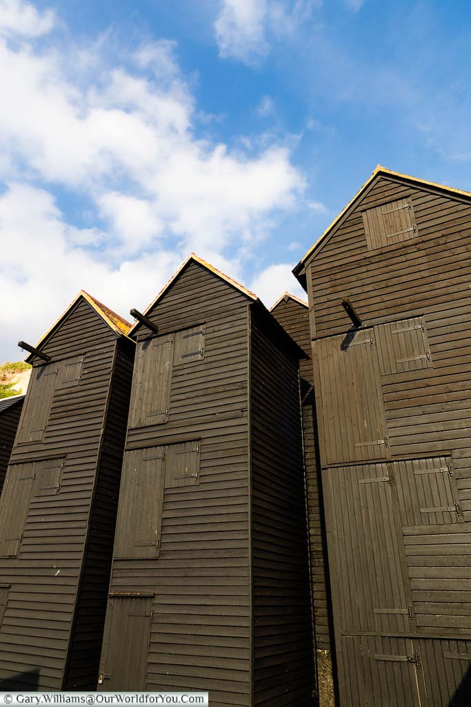 The wooden black weather-boarded net sheds in the Fishing Quarter of Hastings