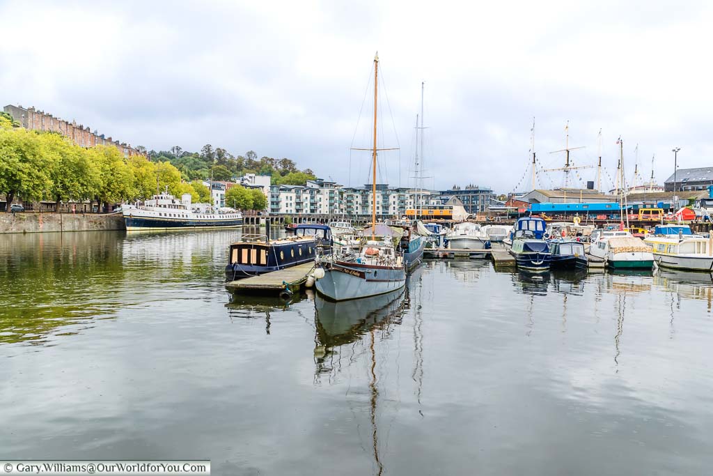 Boats moored up in Bristol Marina under a cloudy sky