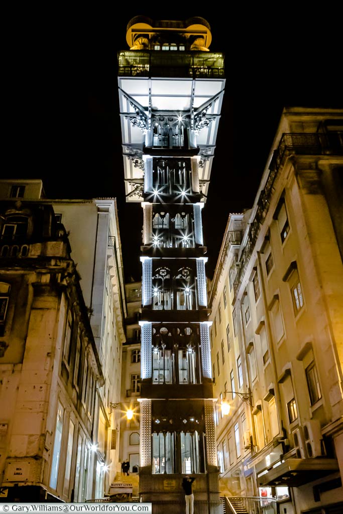 The elegant art deco iron structure of the Elevador de Santa Justa at night in Lisbon, Portugal