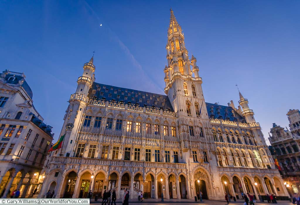 The illuminated Hotel de Ville in the Grand Place at dusk, Brussels, Belgium