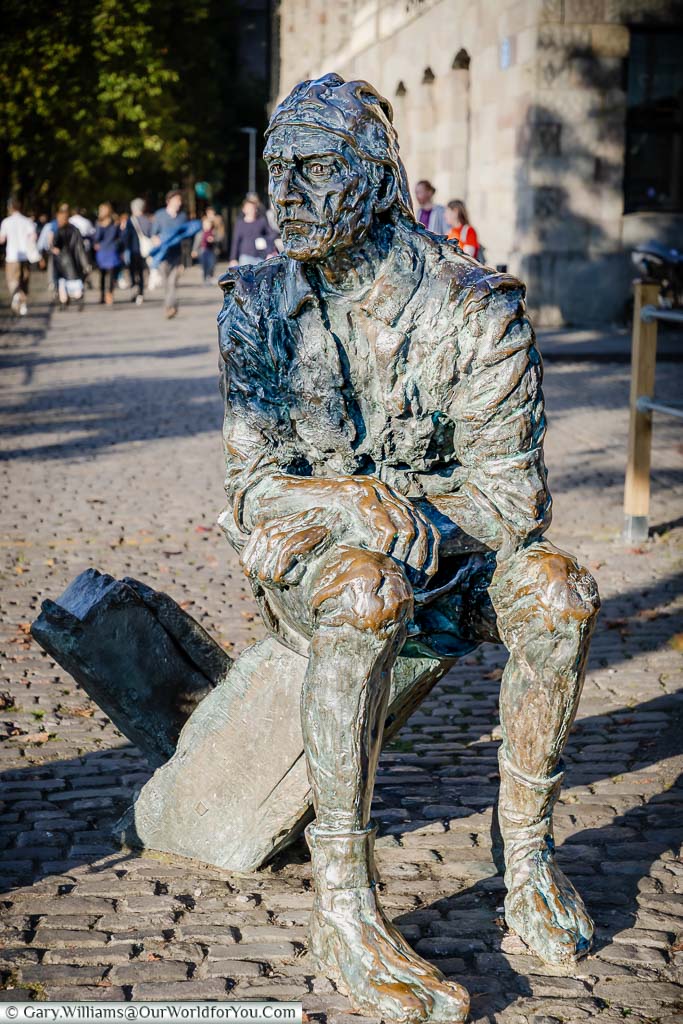 A bronze statue to John Cabot seated in the harbour of Bristol