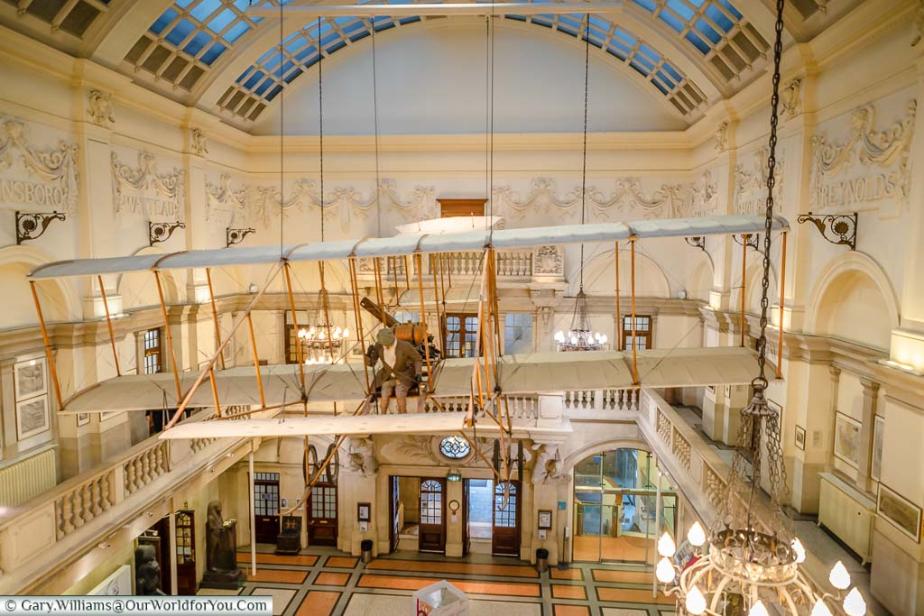 A model of the Bristol Boxkite suspended from the ceiling of the classically styled Bristol Museum & Art Gallery