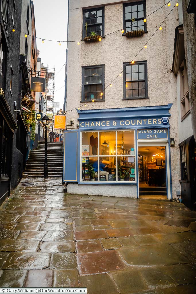 The Chance & Counters cafe at the base of the Christmas Steps in Bristol on a damp day