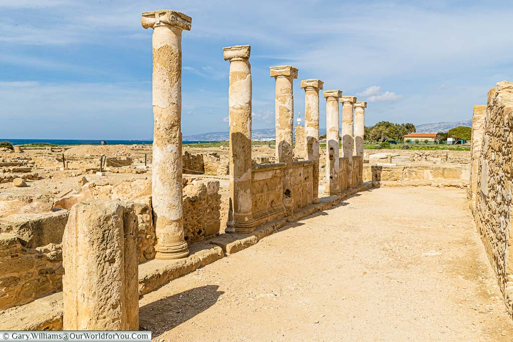 A row of open-air sandstone columns in what would have been the House of Aion in the Nea Pafos Archaeological Site