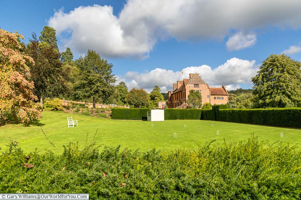 Thre croquet lawn, complete with white hoops, with Chartwell house in the background.