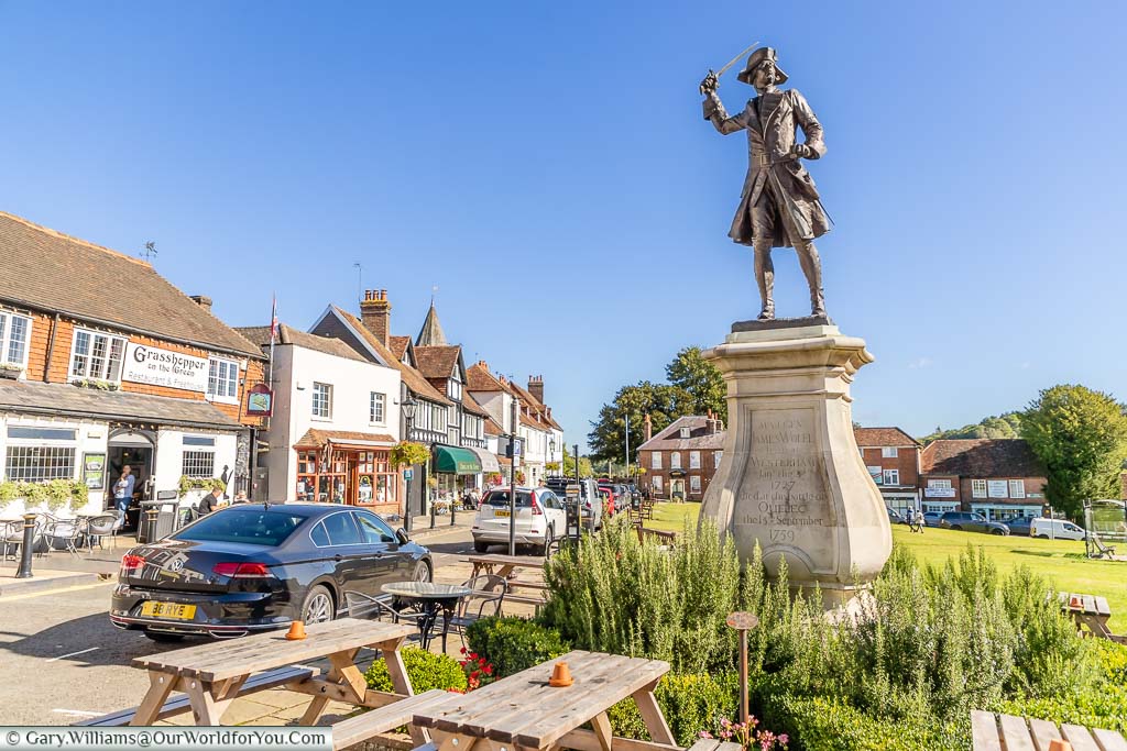 A statue to General James Wolfe in the quaint, shops lined, Westerham Green in Kent