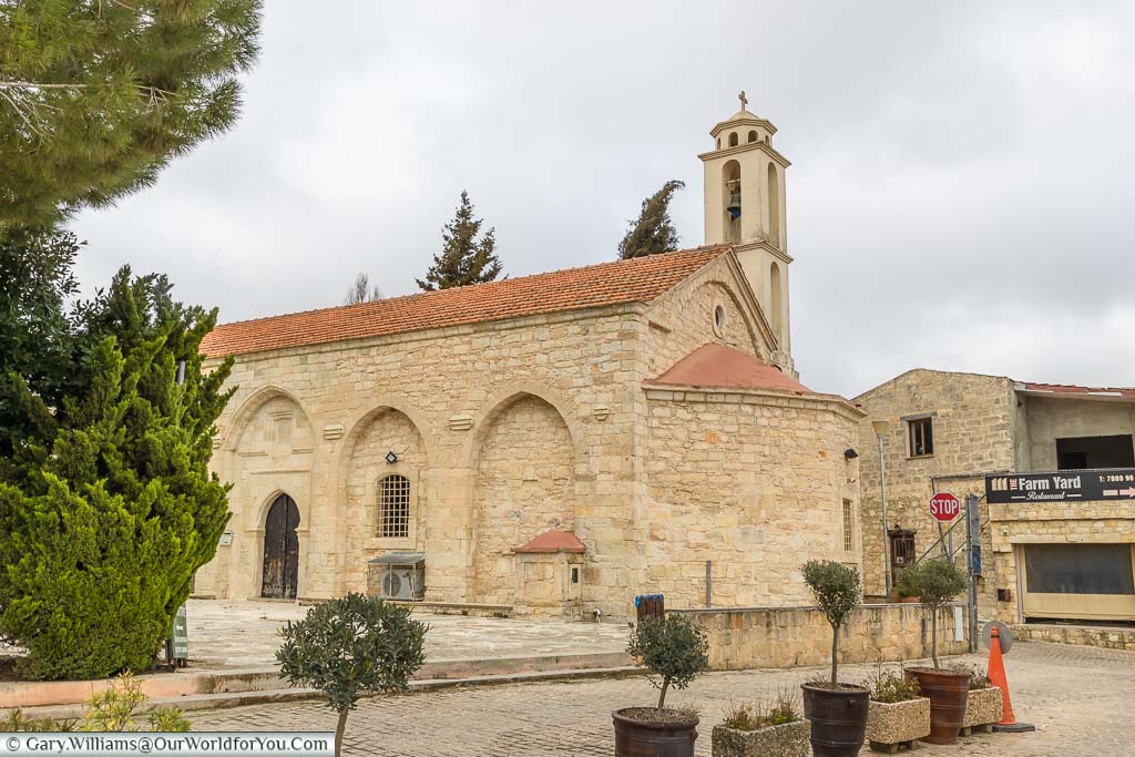 The golden stone church at the centre of the Kathikas village high in the hills of western Cyprus
