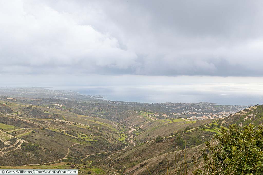A view of the coastline of western Cyprus on an overcast day from a layby in the hills of Peyia.