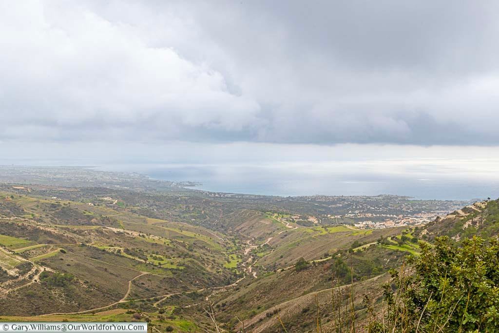 A view of the coastline of western Cyprus on an overcast day from a layby in the hills of Peyia.