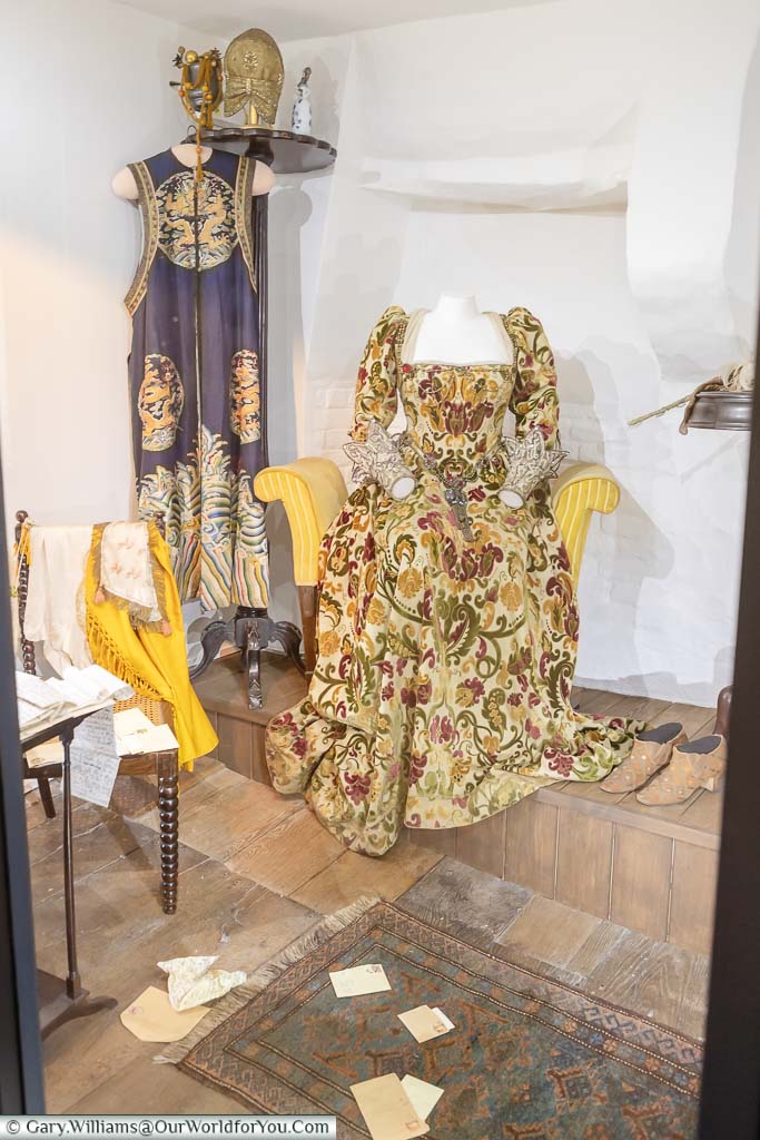 A costume from a Victorian production of Shakespeare's 'Much Ado About Nothing' worn by a headless, seated mannequin on display in Smallhythe Place