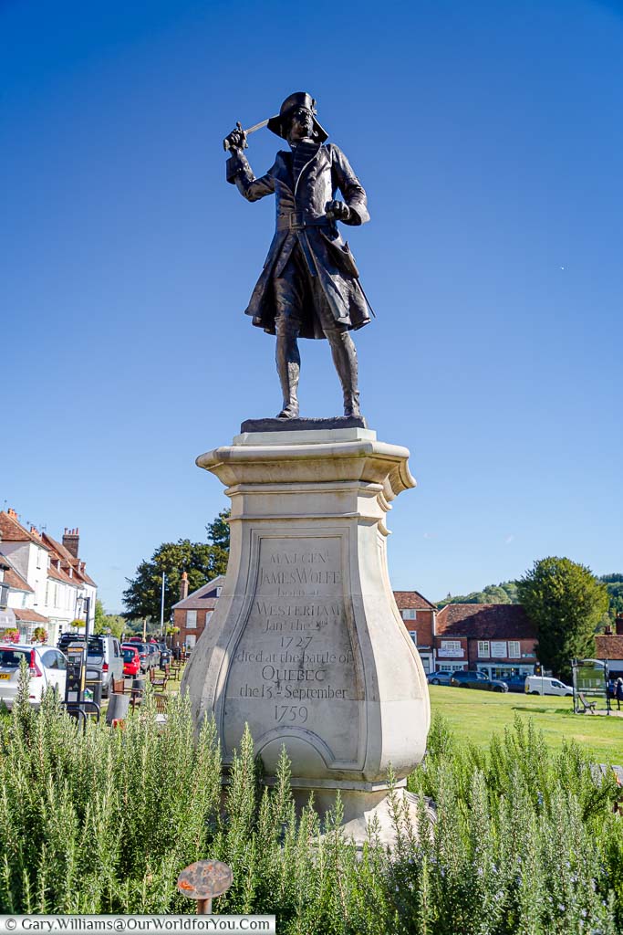 A bronze statue to Major General James Wolfe on a stone plinth on the edge of Westerham Green in Westerham, Kent
