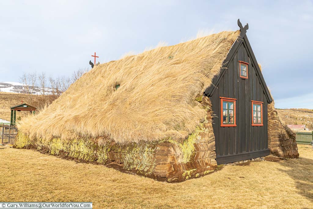 The side view of the wooden Víðimýrarkirkja church with its turfed roof in northwest Iceland