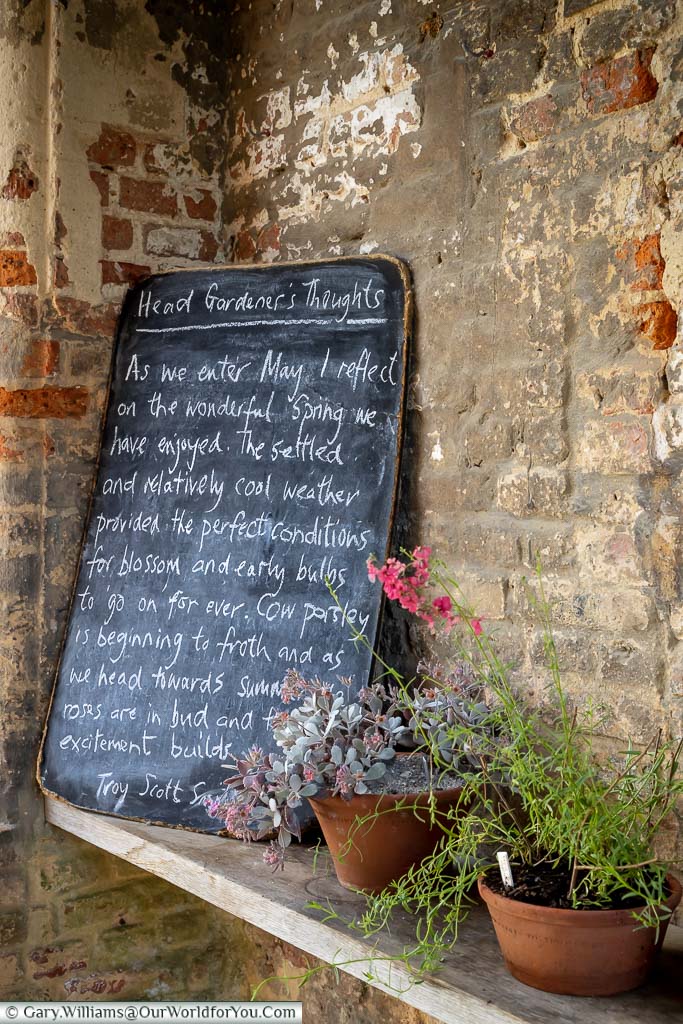 A small blackboard with chalk writing outlining the Head Gardener’s thoughts on the planting in the National Trust's Sissinghurst Castle Gardens
