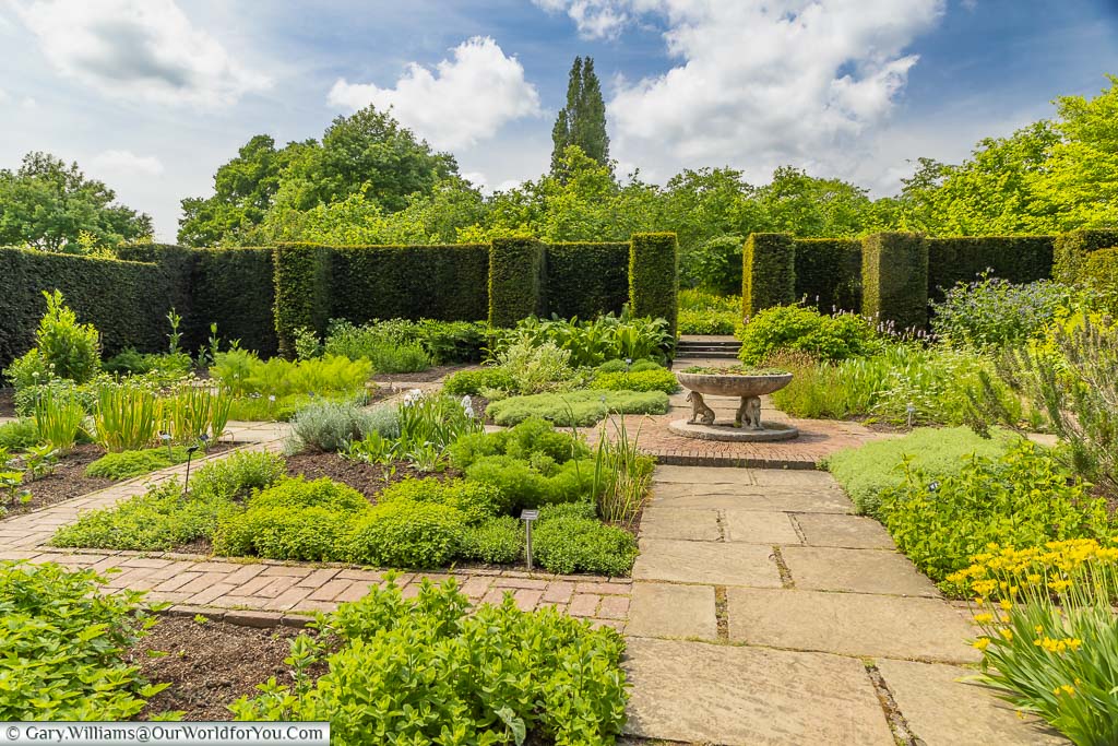 The formal square beds of the boxus lined herb garden at Sissinghurst Castle Garden