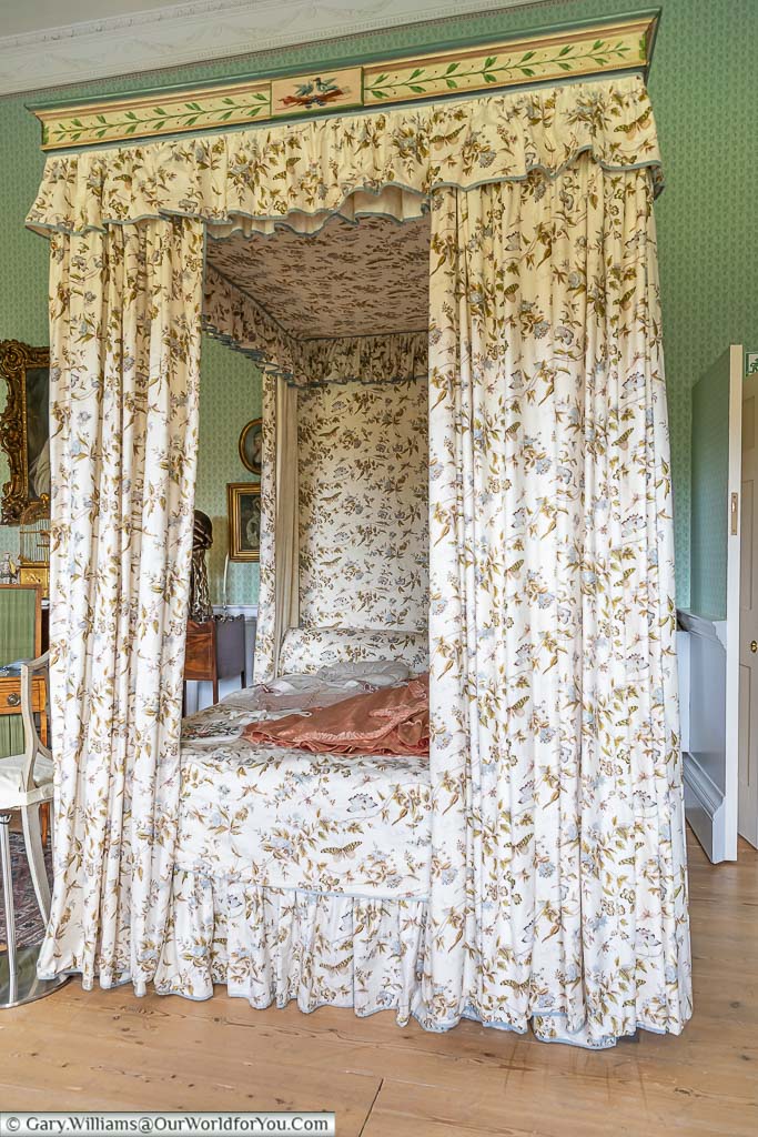 A small four-poster bed with matching chintz drapes, surrounds and bedcovers popular with ladies in georgian times