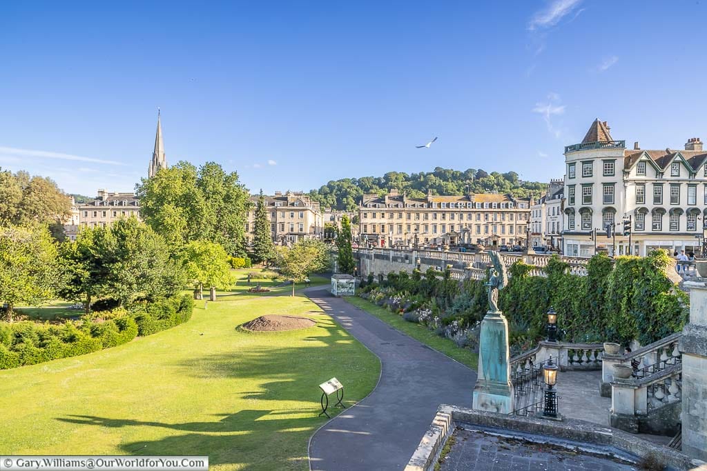 Parade Gardens in the early evening under blue skies with the city of Bath as the backdrop