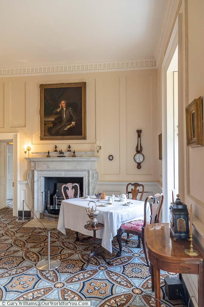 A small table within the parlour of number one royal crescent set for afternoon tea.