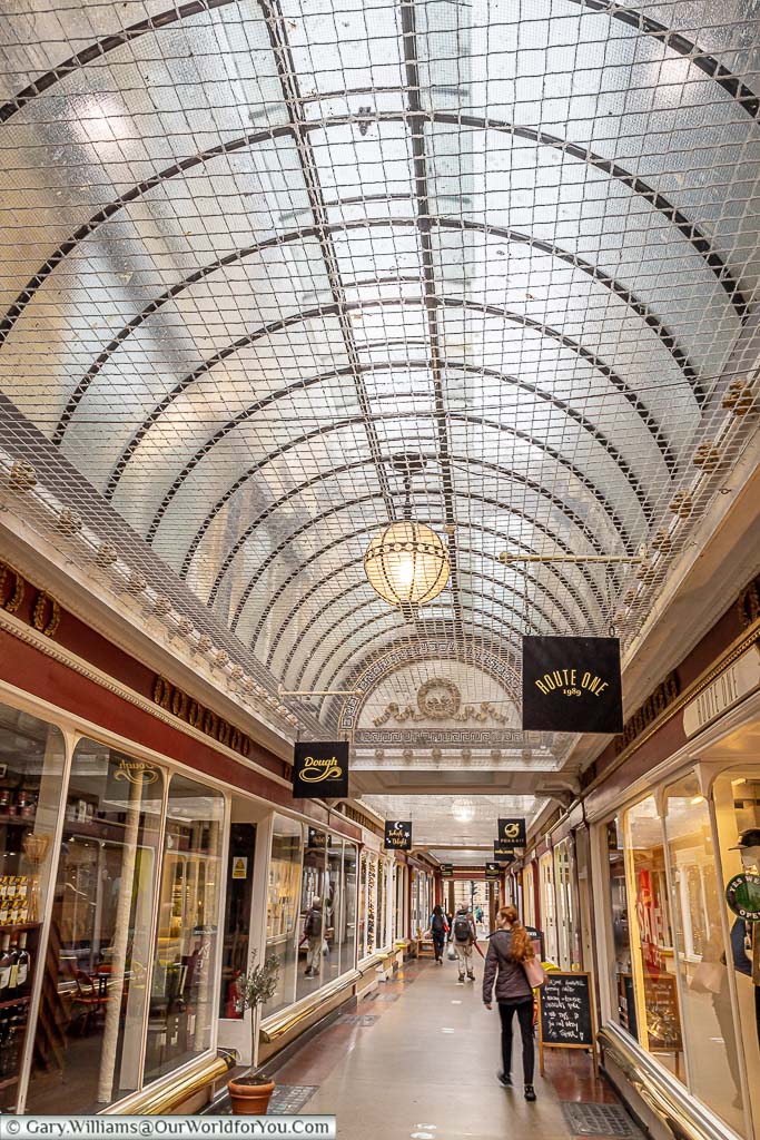 The Corridor shopping lane with its curved glass ceiling and boutique shops in Bath