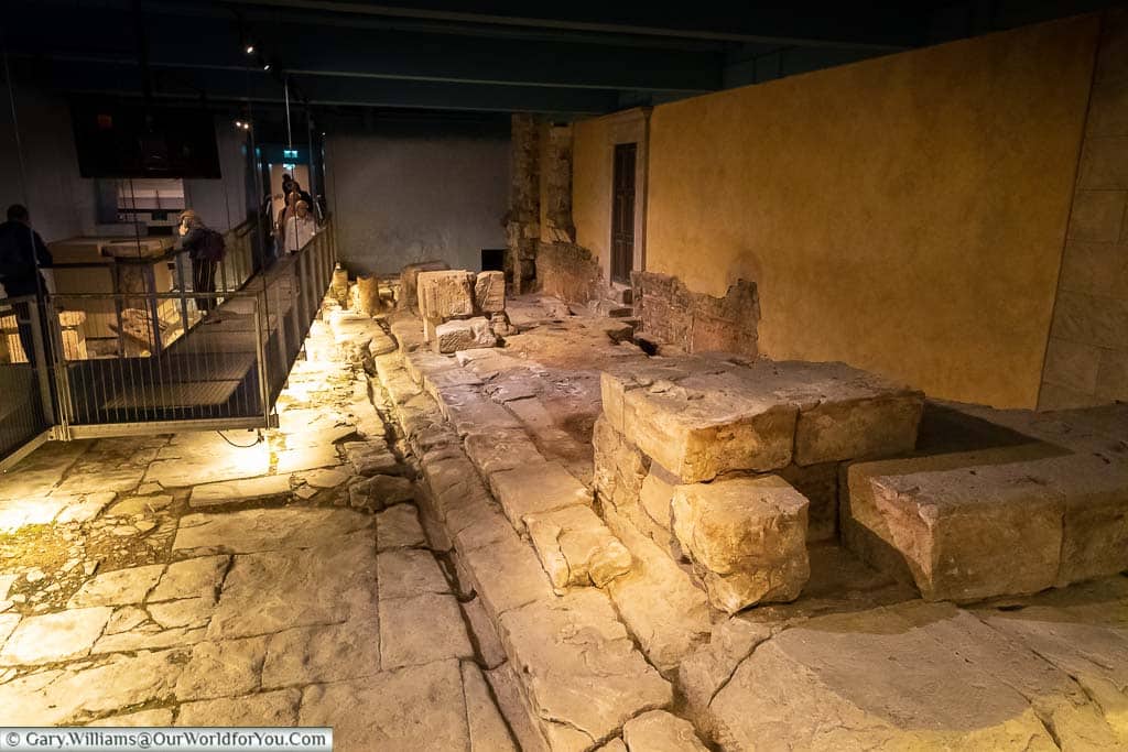 The stone pathways of the Temple Courtyard in Bath's Roman bath museum