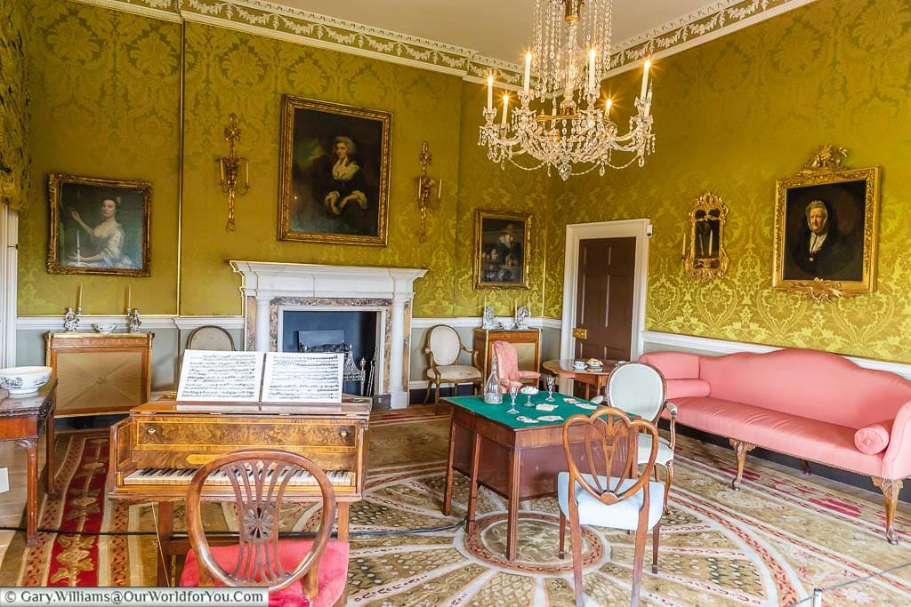 The lounge area known as the Withdrawing Room in georgian times, with a harpsichord, a card table and sofas, where the family would come after diner.