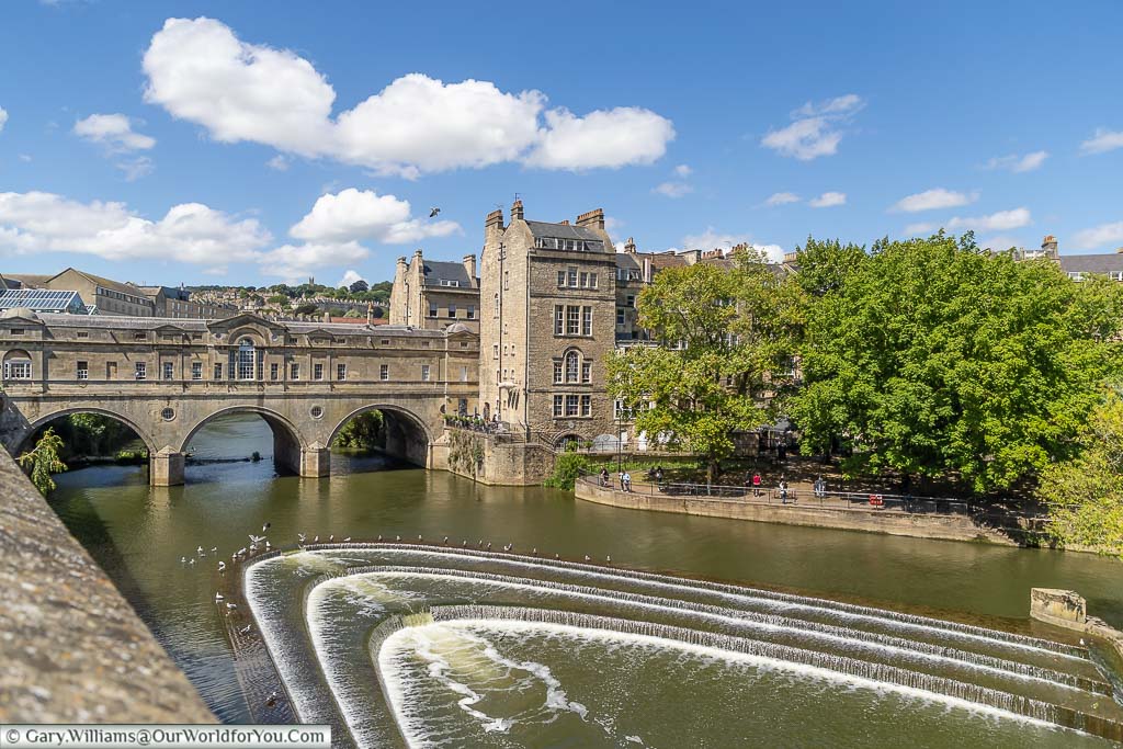Pulteney Bridge and the weir in the River Avon in Bath as seen from the Grande Parade